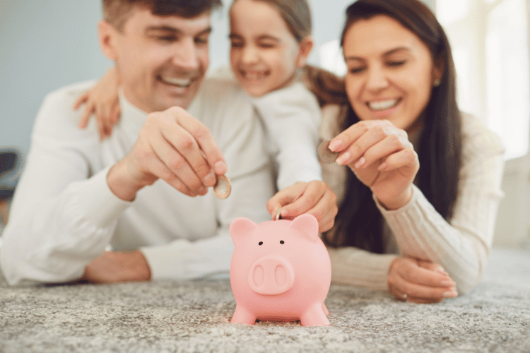 Happy Family Saves Money in a Piggy Bank Pig